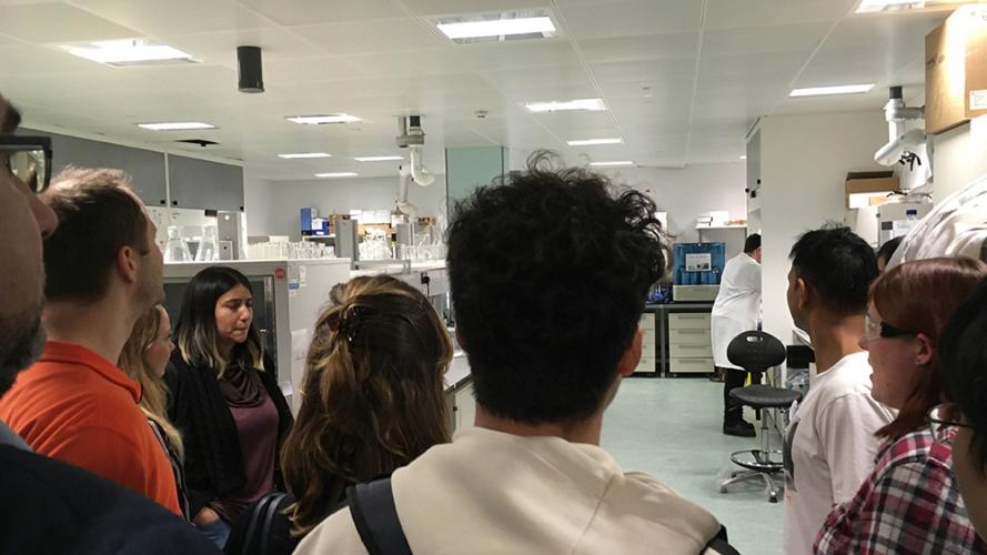 photo of lab manager giving students tour