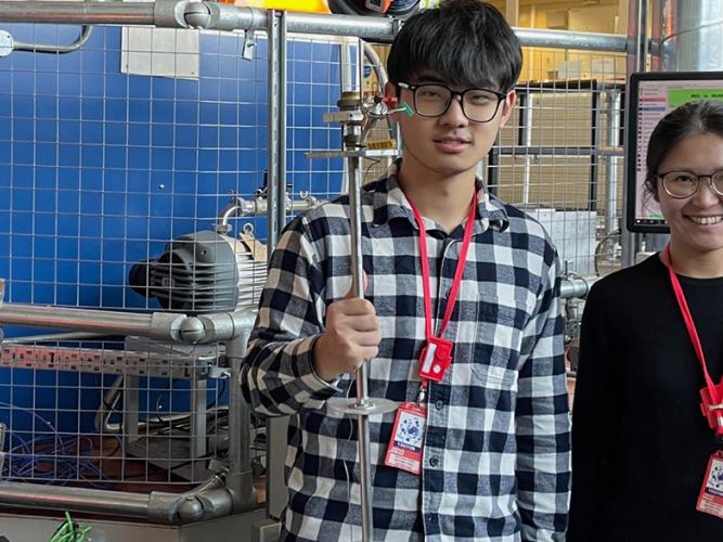 photo of two researchers in the ISIS lab