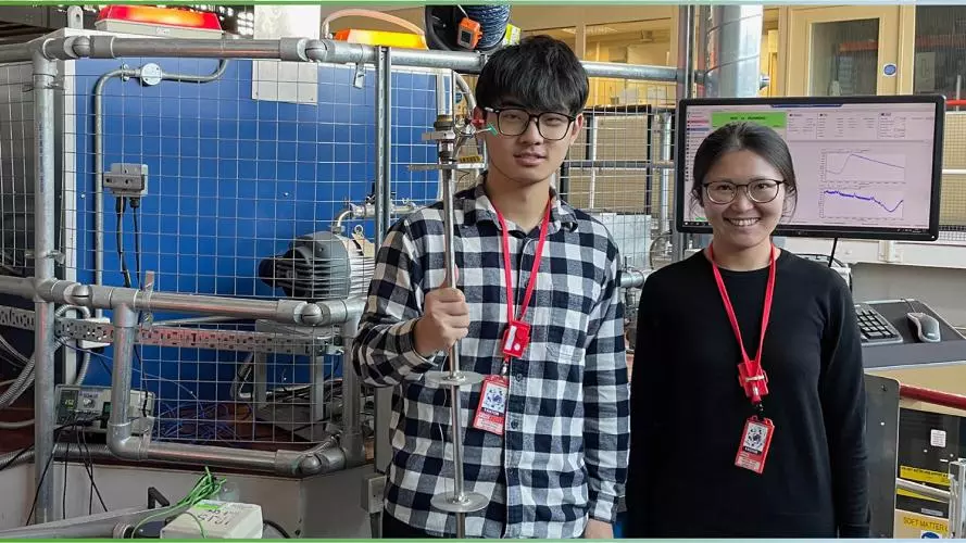 photo of two researchers in the ISIS lab